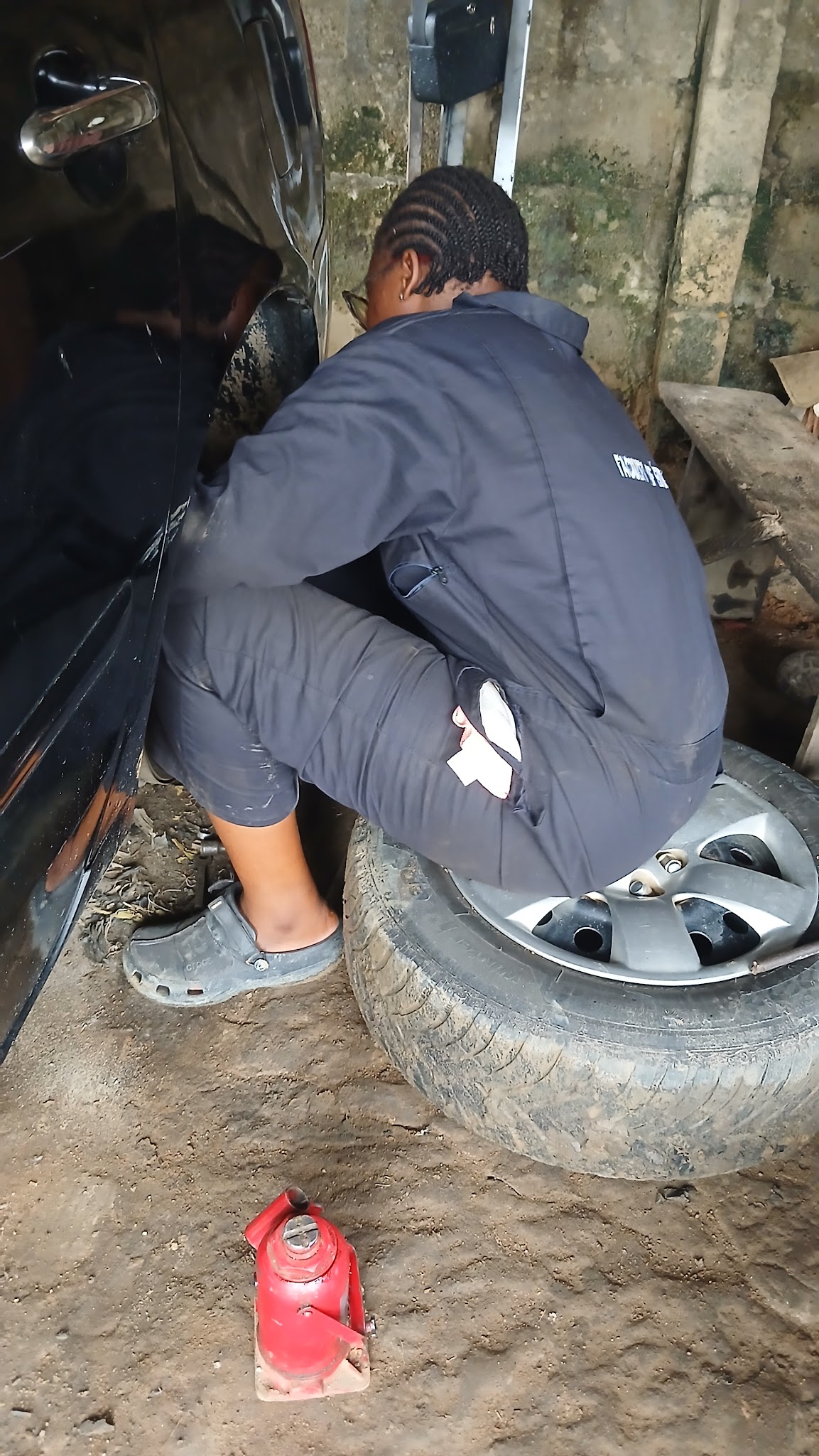 Michelle replacing the camber on an old-model Toyota